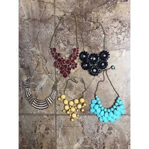 Various colorful statement necklaces.